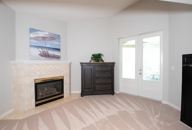916 Bunker View Dr, Apollo Beach, FL 33572 - entrance foyer featuring a tiled fireplace, carpet floors, and french doors