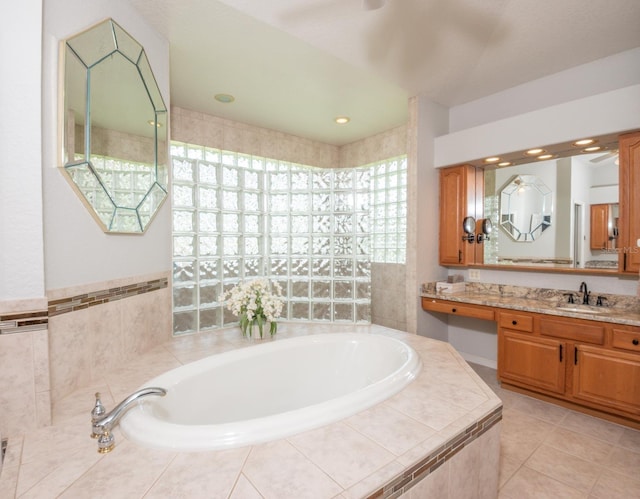 916 Bunker View Dr, Apollo Beach, FL 33572 - full bathroom with a garden tub, vanity, and tile patterned flooring