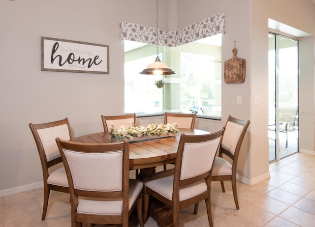 916 Bunker View Dr, Apollo Beach, FL 33572 - dining room with baseboards and light tile patterned flooring