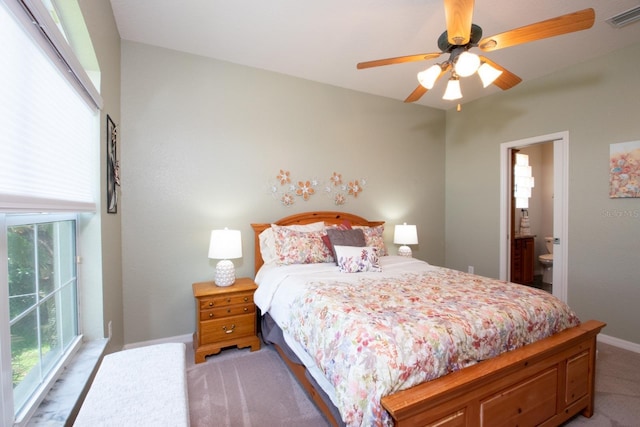 916 Bunker View Dr, Apollo Beach, FL 33572 - bedroom with light carpet, ensuite bath, and a ceiling fan