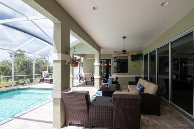 916 Bunker View Dr, Apollo Beach, FL 33572 - outdoor pool with a patio area, ceiling fan, an outdoor living space, glass enclosure, and outdoor dining area