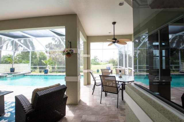 916 Bunker View Dr, Apollo Beach, FL 33572 - view of swimming pool featuring glass enclosure, a patio, a pool with connected hot tub, and ceiling fan
