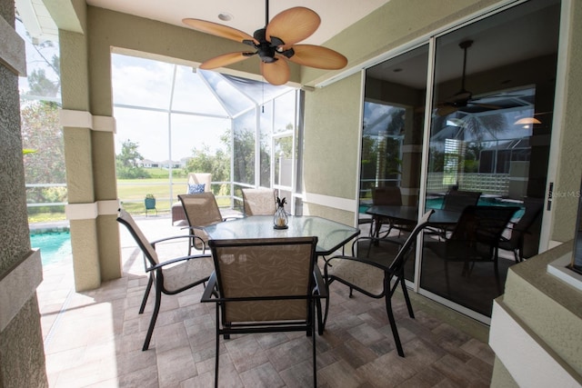916 Bunker View Dr, Apollo Beach, FL 33572 - sunroom / solarium with a ceiling fan and outdoor dining space