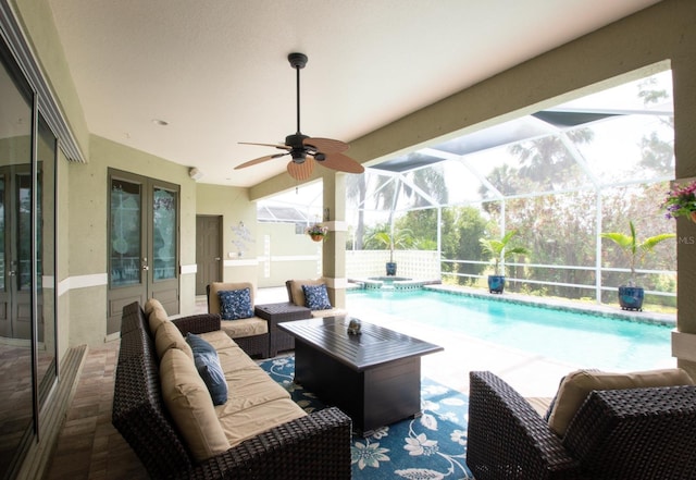 916 Bunker View Dr, Apollo Beach, FL 33572 - view of patio / terrace featuring a pool with connected hot tub, ceiling fan, outdoor lounge area, and glass enclosure