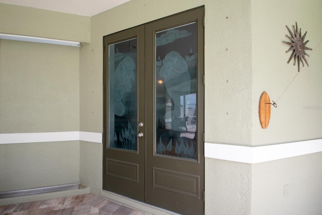 916 Bunker View Dr, Apollo Beach, FL 33572 - doorway to property featuring french doors and stucco siding