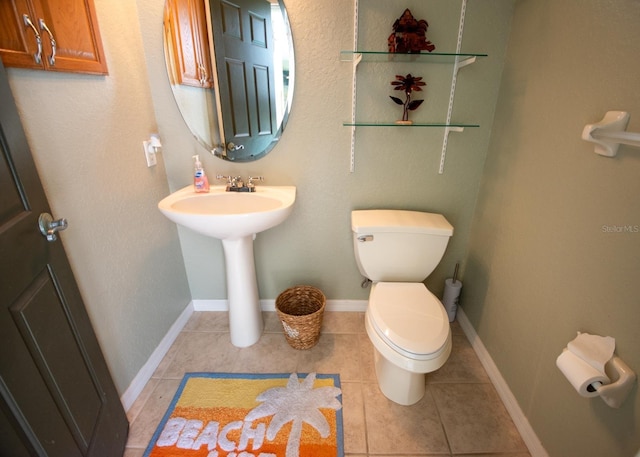 916 Bunker View Dr, Apollo Beach, FL 33572 - half bathroom with toilet and tile patterned floors