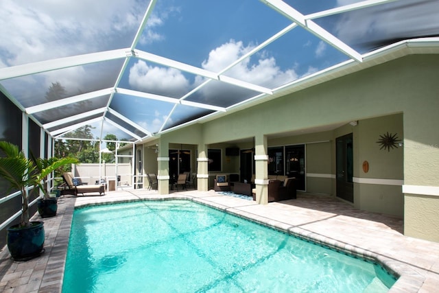 916 Bunker View Dr, Apollo Beach, FL 33572 - outdoor pool with a patio area, glass enclosure, and an outdoor hangout area