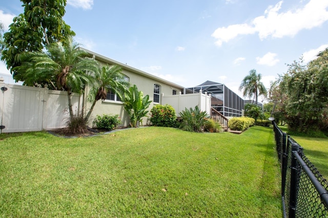 916 Bunker View Dr, Apollo Beach, FL 33572 - fenced backyard with glass enclosure