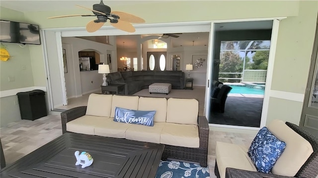 916 Bunker View Dr, Apollo Beach, FL 33572 - living room featuring ceiling fan and arched walkways