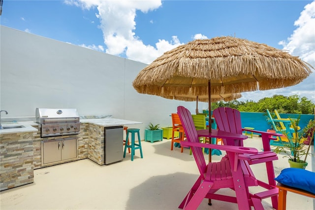 6210 64th Way N, Pinellas Park, FL 33781 - view of patio / terrace with area for grilling and a bar