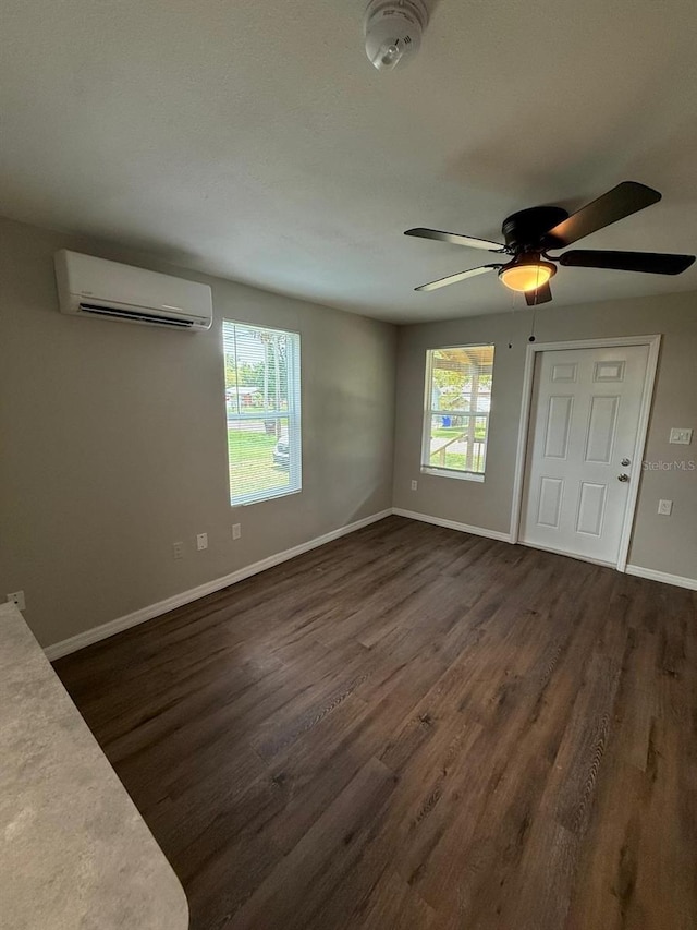 1512 7th St, Saint Cloud, FL 34769 - unfurnished living room featuring a wall mounted AC, dark wood-type flooring, and ceiling fan