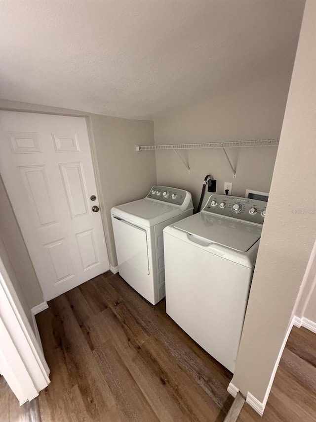 1512 7th St, Saint Cloud, FL 34769 - washroom featuring washer and clothes dryer and dark wood-style flooring