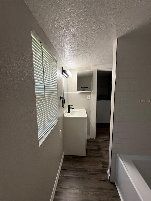 1512 7th St, Saint Cloud, FL 34769 - hallway featuring a textured ceiling and dark wood finished floors