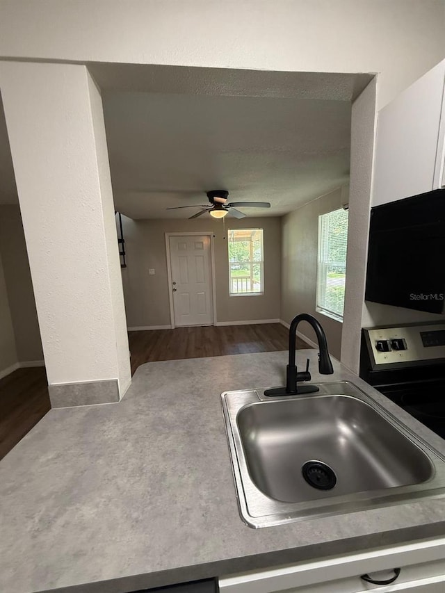 1512 7th St, Saint Cloud, FL 34769 - kitchen featuring ceiling fan and wood finished floors