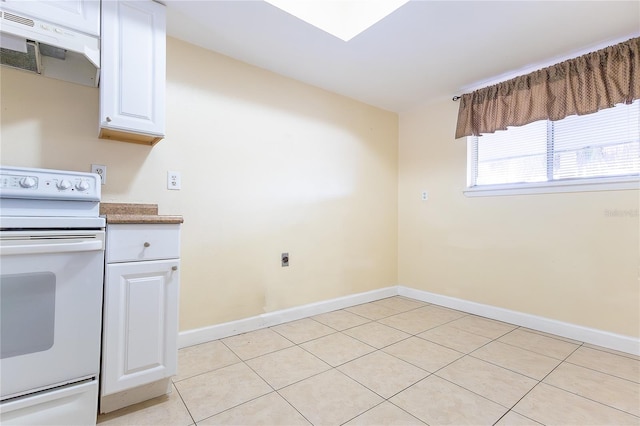 6332 Newtown Cir Unit 32B2, Tampa, FL 33615 - kitchen featuring white range with electric cooktop, under cabinet range hood, white cabinets, and light tile patterned flooring