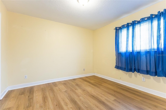 6332 Newtown Cir Unit 32B2, Tampa, FL 33615 - spare room with wood finished floors and a textured ceiling