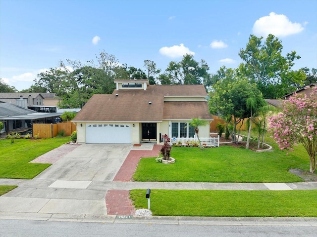 15711 Springmoss Ln, Tampa, FL 33624 - view of front facade with a garage and concrete driveway