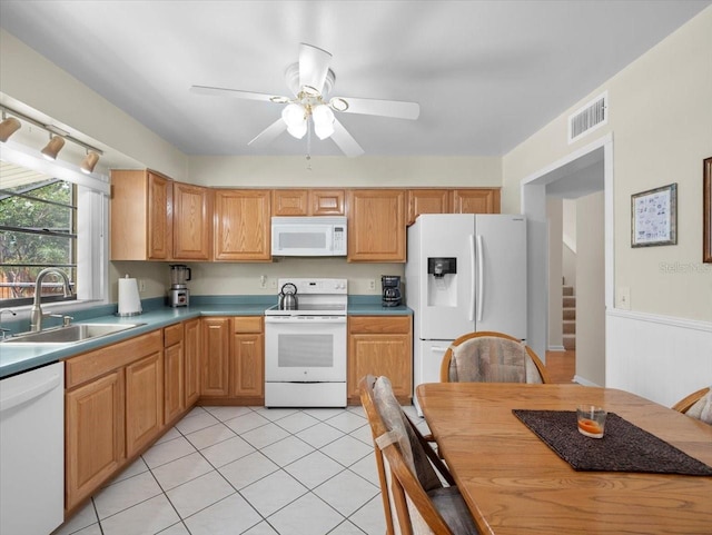15711 Springmoss Ln, Tampa, FL 33624 - kitchen with white appliances, a ceiling fan, and light tile patterned floors