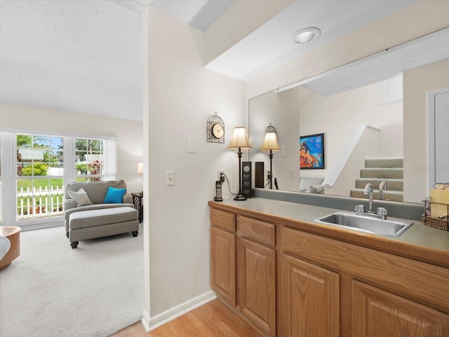 15711 Springmoss Ln, Tampa, FL 33624 - bar with stairs, a textured ceiling, and light wood-style flooring