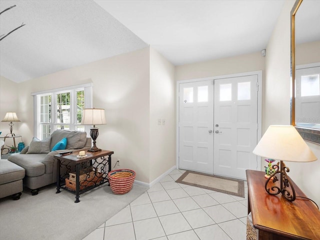 15711 Springmoss Ln, Tampa, FL 33624 - foyer entrance with healthy amount of natural light, light carpet, and lofted ceiling