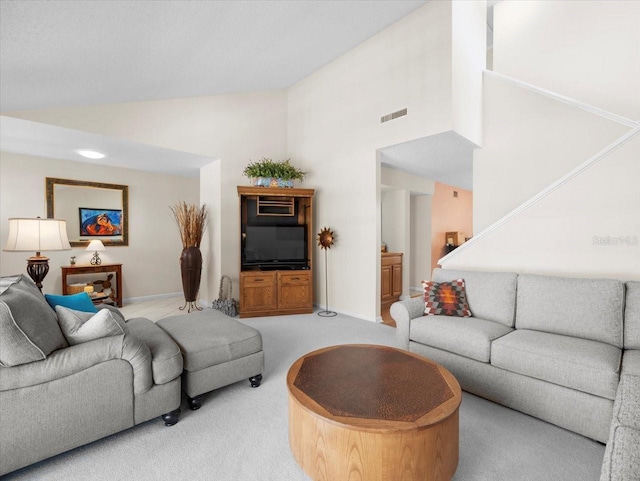 15711 Springmoss Ln, Tampa, FL 33624 - living area featuring carpet floors and high vaulted ceiling