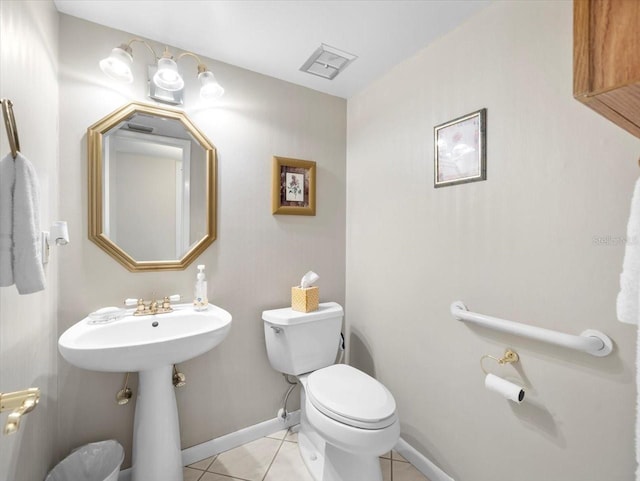 15711 Springmoss Ln, Tampa, FL 33624 - half bathroom featuring toilet and tile patterned floors