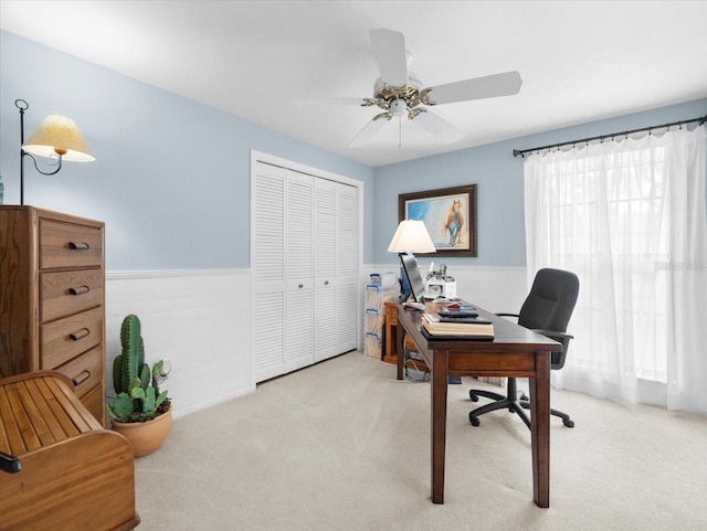 15711 Springmoss Ln, Tampa, FL 33624 - office area with light carpet, wainscoting, and a ceiling fan
