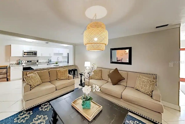 4505 S Clark Ave, Tampa, FL 33611 - living area featuring light tile patterned flooring