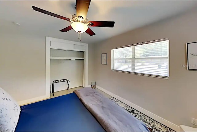 4505 S Clark Ave, Tampa, FL 33611 - exercise room with ceiling fan and baseboards
