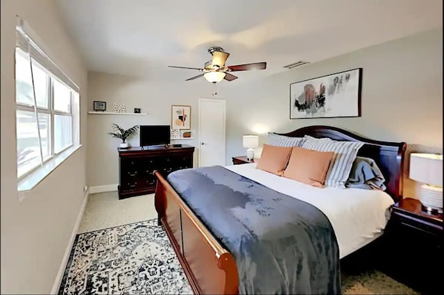4505 S Clark Ave, Tampa, FL 33611 - bedroom featuring ceiling fan and dark speckled floor