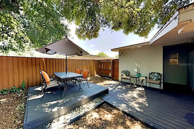 4505 S Clark Ave, Tampa, FL 33611 - wooden terrace featuring outdoor dining area