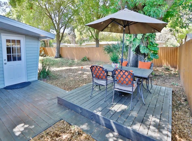 4505 S Clark Ave, Tampa, FL 33611 - deck with outdoor dining space and a fenced backyard