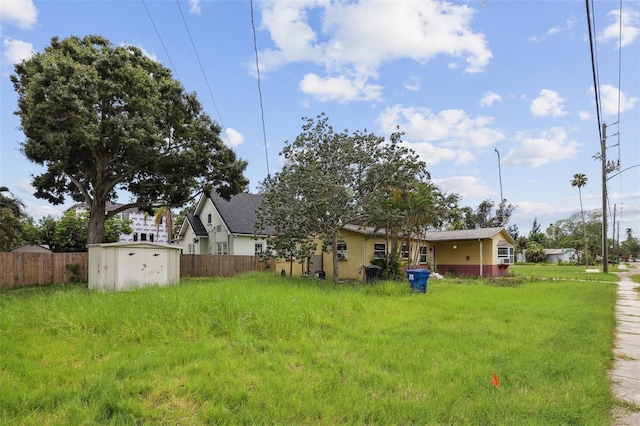 1560 Connecticut Ave NE, Saint Petersburg, FL 33703 - view of yard with a storage unit