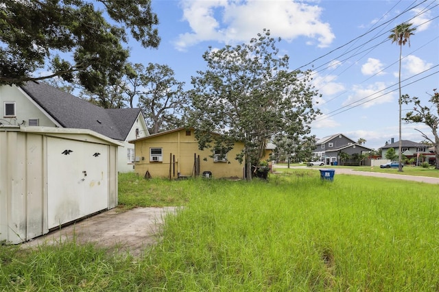 1560 Connecticut Ave NE, Saint Petersburg, FL 33703 - view of yard featuring a storage shed and a residential view