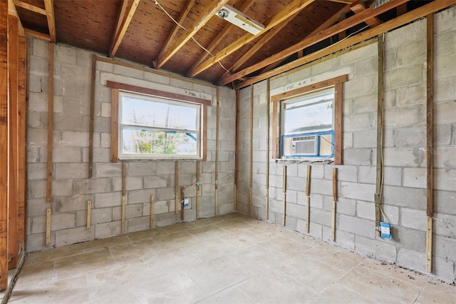 1560 Connecticut Ave NE, Saint Petersburg, FL 33703 - below grade area featuring cooling unit, concrete block wall, and plenty of natural light