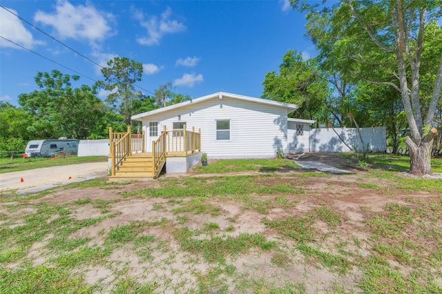 9445 Cardy St, New Port Richey, FL 34654 - view of front of house featuring a wooden deck