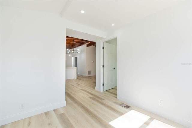 9445 Cardy St, New Port Richey, FL 34654 - unfurnished room featuring light wood-style flooring and recessed lighting