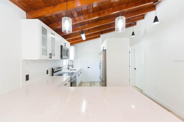 9445 Cardy St, New Port Richey, FL 34654 - kitchen featuring stainless steel appliances, wooden ceiling, light stone countertops, white cabinetry, and glass insert cabinets