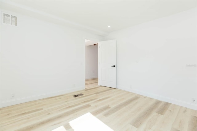 9445 Cardy St, New Port Richey, FL 34654 - empty room featuring light wood-style flooring and recessed lighting