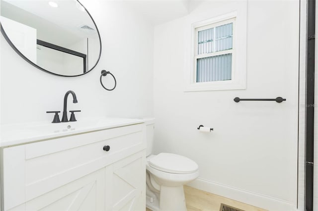 9445 Cardy St, New Port Richey, FL 34654 - bathroom featuring vanity and wood finished floors