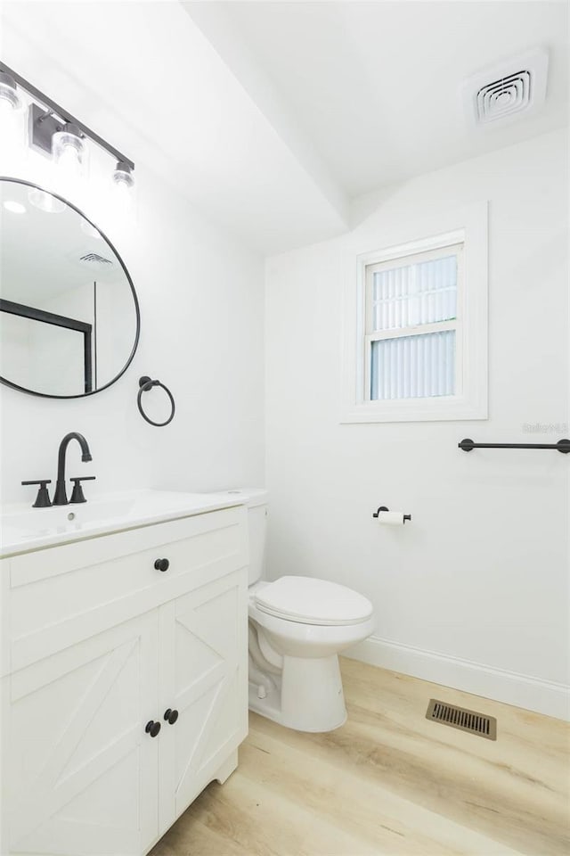 9445 Cardy St, New Port Richey, FL 34654 - bathroom with wood finished floors and vanity