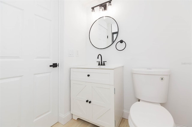 9445 Cardy St, New Port Richey, FL 34654 - bathroom featuring vanity and wood finished floors