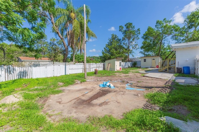 9445 Cardy St, New Port Richey, FL 34654 - fenced backyard featuring a storage shed