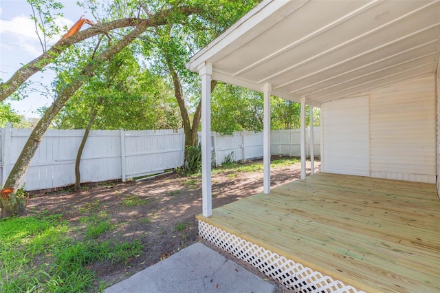 9445 Cardy St, New Port Richey, FL 34654 - fenced backyard with a deck