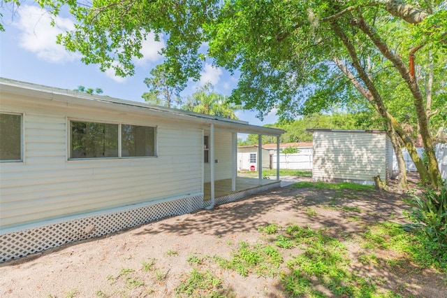 9445 Cardy St, New Port Richey, FL 34654 - view of yard featuring a storage shed