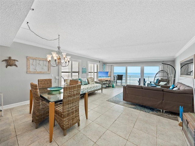 19440 Gulf Blvd Unit 301, Indian Rocks Beach, FL 33785 - dining area with a textured ceiling, ornamental molding, a chandelier, and light tile patterned floors