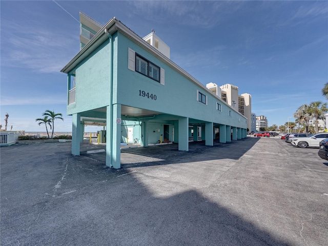 19440 Gulf Blvd Unit 301, Indian Rocks Beach, FL 33785 - view of property with uncovered parking