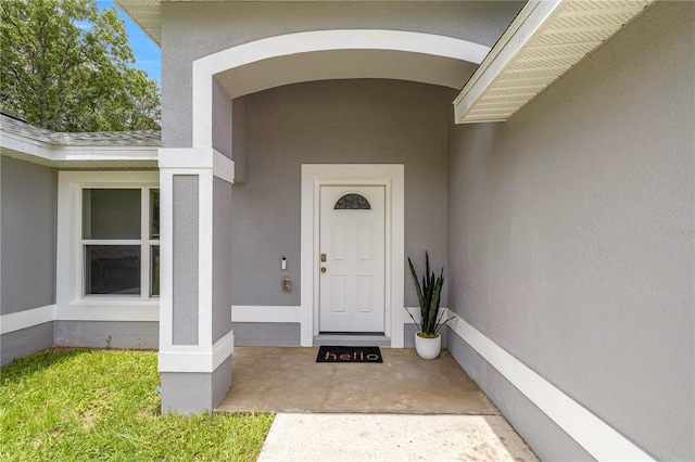 231 Marion Oaks Trl, Ocala, FL 34473 - view of exterior entry featuring stucco siding