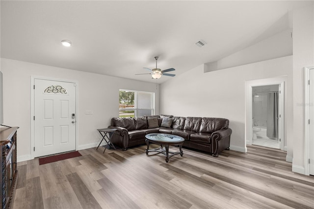 231 Marion Oaks Trl, Ocala, FL 34473 - living room featuring a ceiling fan, wood finished floors, and vaulted ceiling