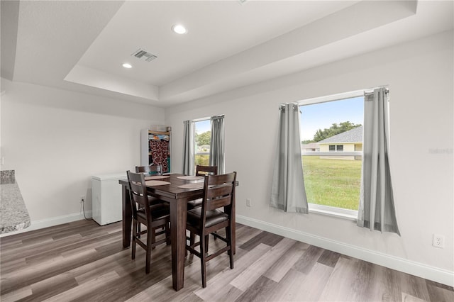 231 Marion Oaks Trl, Ocala, FL 34473 - dining room with a raised ceiling, wood finished floors, and recessed lighting